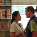 Staff expert helping customer select pet food